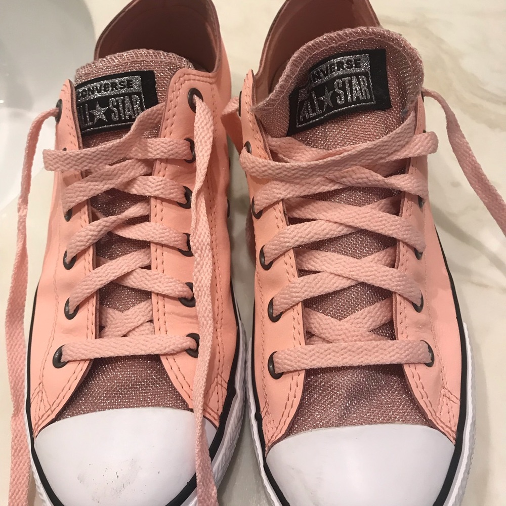 Converse pink sparkly shoes.